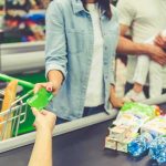 Florida Bans Junk Food From SNAP Customer paying with a card at a supermarket checkout