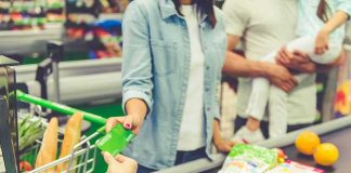 Florida Bans Junk Food From SNAP Customer paying with a card at a supermarket checkout
