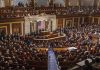 Legislative chamber filled with attendees during a formal address