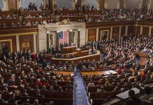 Legislative chamber filled with attendees during a formal address