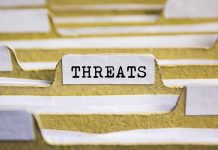 index tab labeled threats in a filing organizer