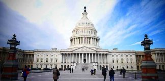 United States Capitol building with visitors on the plaza