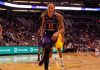 basketball player dribbling on a court during a game