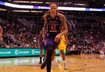basketball player dribbling on a court during a game