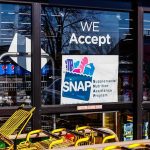 NYC’s Grocery Experiment Is Now in Court Storefront window with SNAP acceptance sign