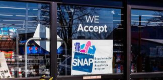 Storefront window with SNAP acceptance sign