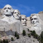 Trump Made Bold Promises at Mount Rushmore Mount Rushmore with four presidential faces carved in rock.