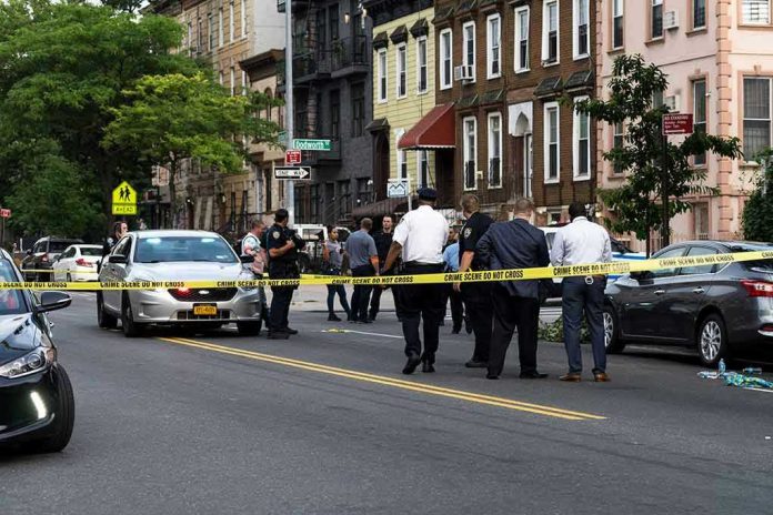 1437619223 Police gathered at an urban crime scene.