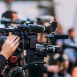 Establishment Wins Wisconsin’s Tight Primary Video cameras on tripods at a media event