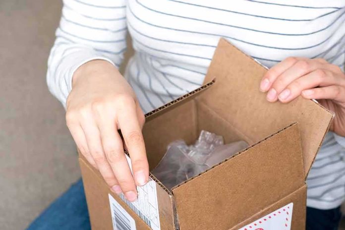 hands opening a cardboard box
