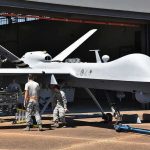 Pilot’s ‘Jellyfish’ Drone Story Sparks New Questions Military drone being serviced by ground crew outside a hangar