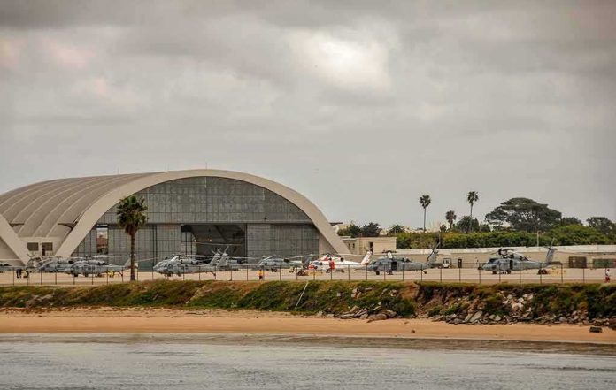 airport hangar with helicopters near a shoreline