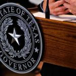Texas governor seal on wooden podium