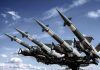 Surface-to-air missiles mounted on a launcher against a blue sky
