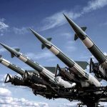 Missiles Rain: Iran-U.S. Confrontation Intensifies Surface-to-air missiles mounted on a launcher against a blue sky