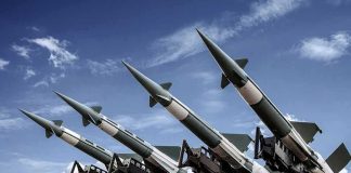Surface-to-air missiles mounted on a launcher against a blue sky