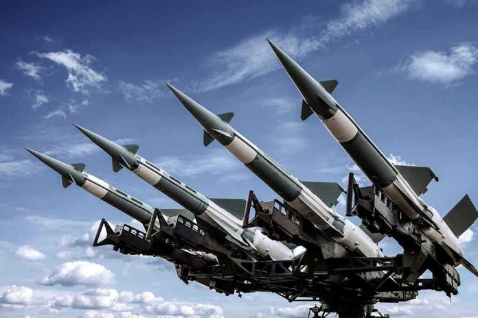 shutterstock_1234726828 Surface-to-air missiles mounted on a launcher against a blue sky
