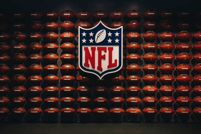 NFL shield logo over wall of footballs