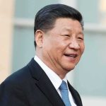 Trump-Xi Summit Puts Ties in Focus man in suit smiling outdoors