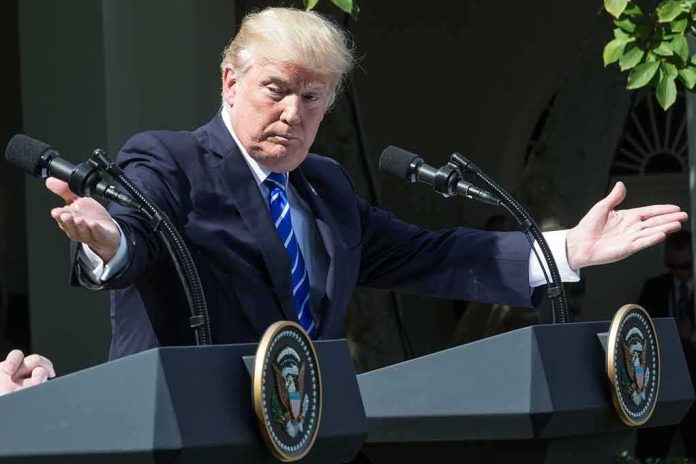 Donald Trump speaking at dual podiums with arms outstretched