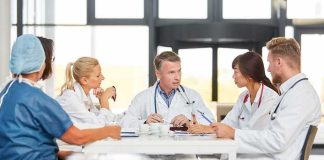 Doctors in a meeting at a hospital conference table