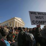 Rent Freeze Backfires: Critics Say Price Controls Will Backfire on Housing Supply Walter Jones, Dan Crary, MyCole Pruitt, and Christian Jones among crowd at protest outside a white capitol building