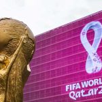 A Split-Second Snub That Overshadowed the World Cup FIFA World Cup trophy in front of Qatar 2022 banner
