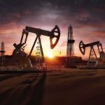 Libya Oil Shutdown Raises Supply Concerns Oil pumpjacks and derricks at sunset in a desert field
