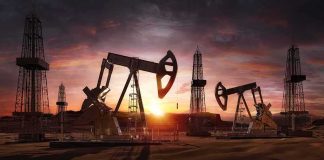 Libya Oil Shutdown Raises Supply Concerns Oil pumpjacks and derricks at sunset in a desert field