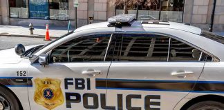 FBI Police patrol car parked on city street