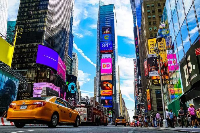 Times Square street with yellow taxi and bright billboards