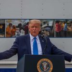 Deal Or Mirage? Iran Denies a Final Deal Donald Trump speaks at a podium with arms outstretched