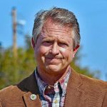 Roger Marshall outdoors in a brown blazer
