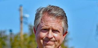 Roger Marshall outdoors in a brown blazer