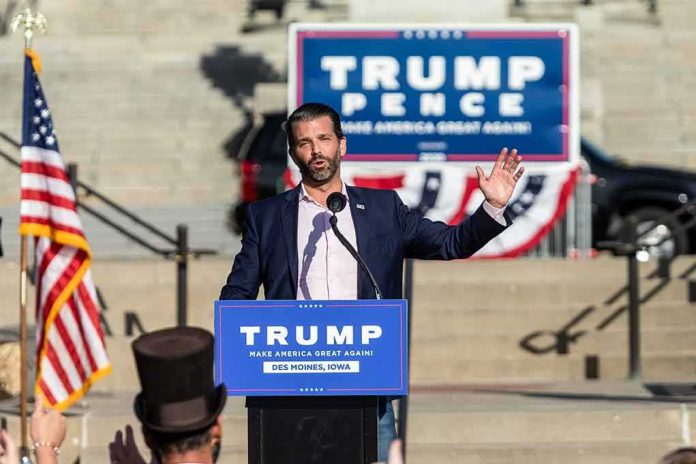 man speaking at a political rally podium