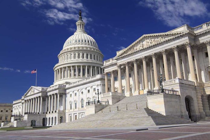 shutterstock_193931348-2 The U.S. Capitol building with its dome and columns under a blue sky