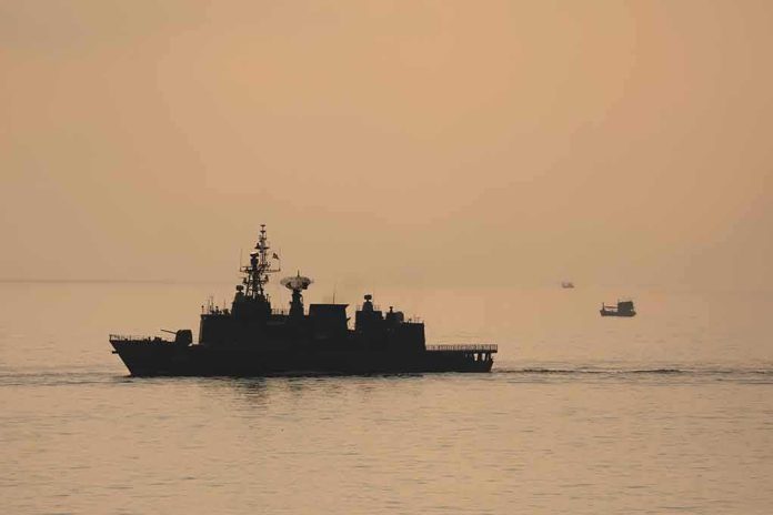 naval ship silhouette at sea during sunset