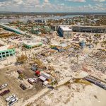7.7-magnitude Monster Quake Slams Indonesia Aerial view of coastal town with widespread storm damage