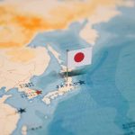 Oil Shock Sparks New Crisis Fears Across Asia Japanese flag pin marking Japan on a world map
