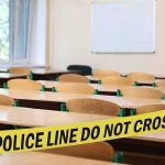 Police Probe Underway After Adolf Hitler Photo Printed Empty classroom with police tape across desks