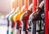 Close-up of fuel pump nozzles at a gas station
