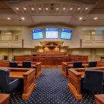Sanctuary Fight Heats Up in New York Courtroom interior with wooden benches and judge's bench