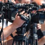 Penalty Drama Sends France Into Last Eight television cameras on tripods at a media event