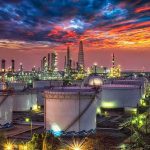U.S. Eyes Oil to Rebuild Emergency Reserves Oil refinery with storage tanks at sunset