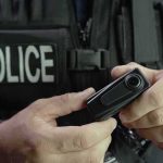 Shocking School Stabbing Video Raises Doubts Police officer holding a body camera