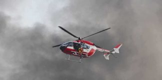 Helicopter Crashes While Covering Crash Rescue helicopter hovers amid thick smoke