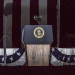 Trump’s July Fourth Speech Casts Communism Presidential podium with microphones and teleprompters