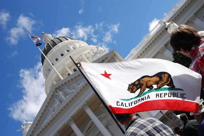shutterstock_642199051-1 California state flag in front of a white domed capitol building