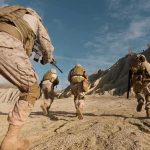 Israel Claims Control of Strategic Ridge Soldiers in desert camouflage running across rocky terrain