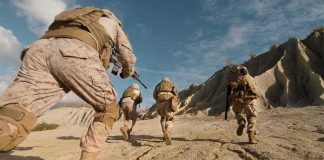 Israel Claims Control of Strategic Ridge Soldiers in desert camouflage running across rocky terrain